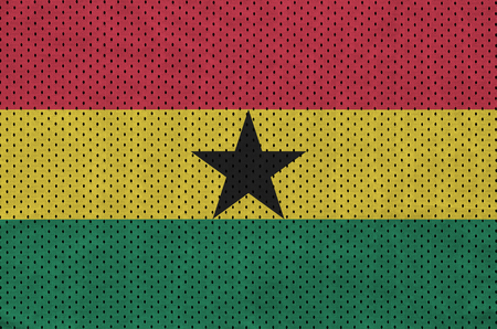 Ghana flag printed on a polyester nylon sportswear mesh fabric with some foldsの写真素材