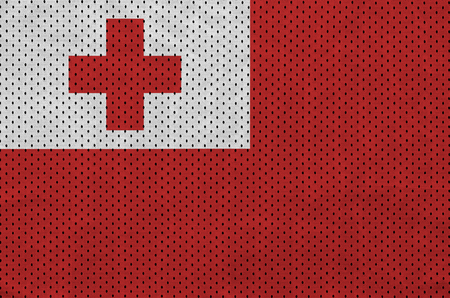 Tonga flag printed on a polyester nylon sportswear mesh fabric with some foldsの写真素材