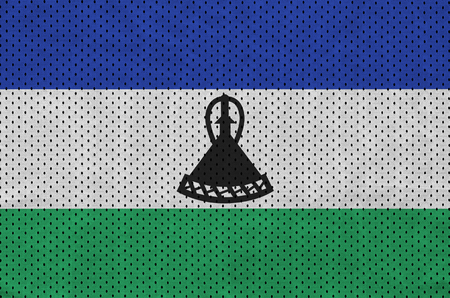 Lesotho flag printed on a polyester nylon sportswear mesh fabric with some foldsの写真素材