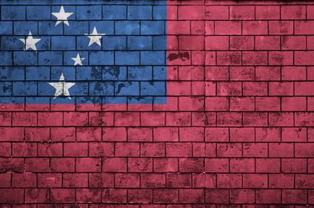 Samoa flag is painted onto an old brick wallの写真素材