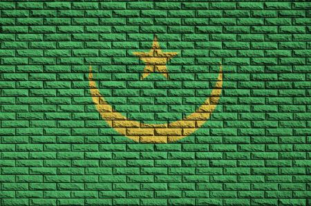 Mauritania flag is painted onto an old brick wallの写真素材