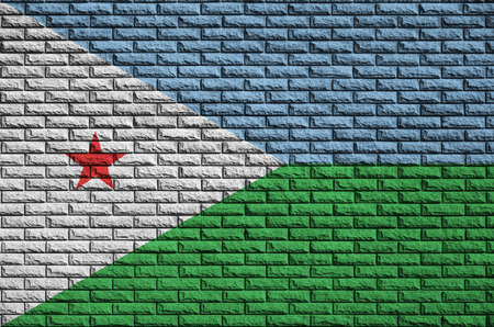 Djibouti flag is painted onto an old brick wallの写真素材