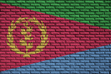 Eritrea flag is painted onto an old brick wallの写真素材