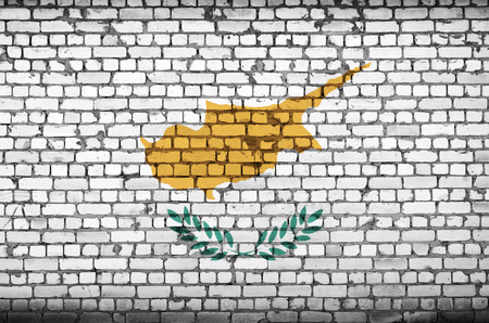 Cyprus flag is painted onto an old brick wallの写真素材