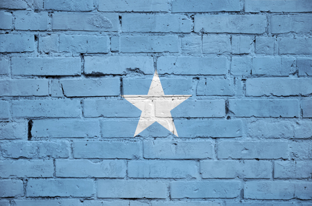 Somalia flag is painted onto an old brick wallの写真素材