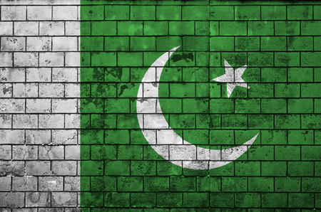 Pakistan flag is painted onto an old brick wallの写真素材
