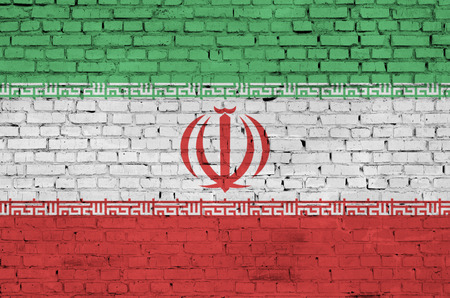 Iran flag is painted onto an old brick wallの写真素材