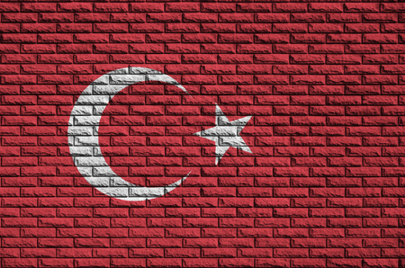 Turkey flag is painted onto an old brick wallの写真素材