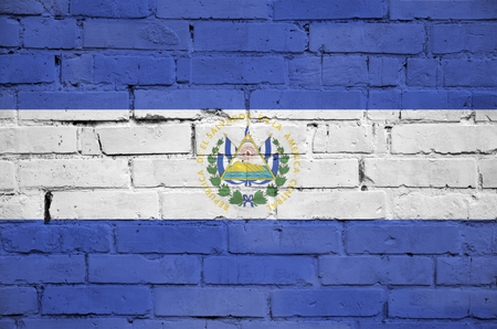 El Salvador flag is painted onto an old brick wallの写真素材