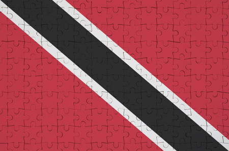 Trinidad and Tobago flag  is depicted on a folded puzzleの写真素材