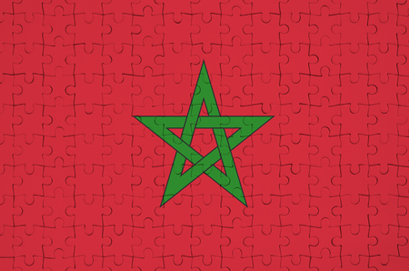 Morocco flag  is depicted on a folded puzzleの写真素材