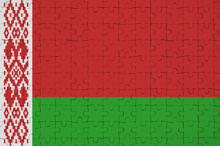 Belarus flag  is depicted on a folded puzzleの写真素材
