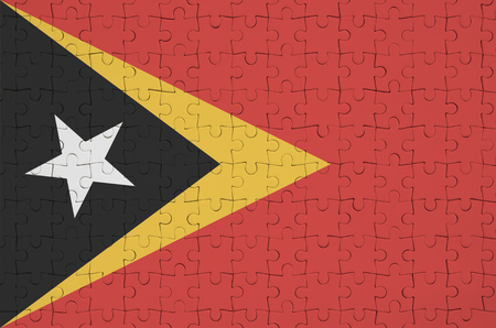 Timor Leste flag  is depicted on a folded puzzleの写真素材