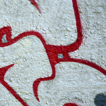 Street art. Abstract background image of a fragment of a colored graffiti painting in chrome and red tones.の写真素材