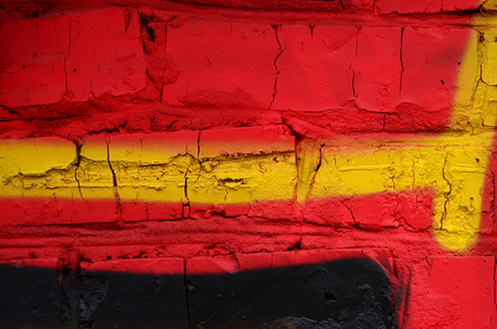Street art. Abstract background image of a fragment of a colored graffiti painting in chrome and red tones.の写真素材