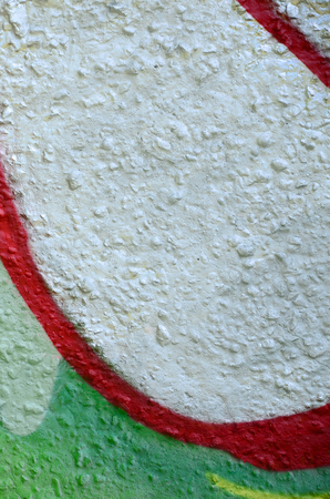 Street art. Abstract background image of a fragment of a colored graffiti painting in chrome and red tones.の写真素材