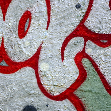 Street art. Abstract background image of a fragment of a colored graffiti painting in chrome and red tones.の写真素材