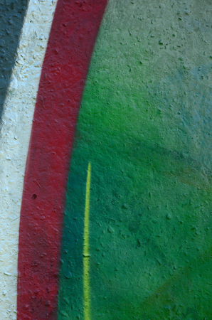 Street art. Abstract background image of a fragment of a colored graffiti painting in chrome and red tones.の写真素材