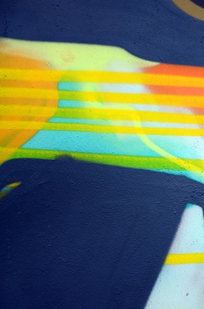 Street art. Abstract background image of a fragment of a colored graffiti painting in khaki green...