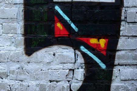 Street art. Abstract background image of a fragment of a colored graffiti painting in chrome and red tones.の写真素材