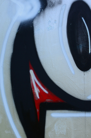 Street art. Abstract background image of a fragment of a colored graffiti painting in chrome and red tones.の写真素材