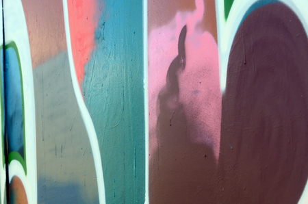 Street art. Abstract background image of a fragment of a colored graffiti painting in fashionable colors.の写真素材