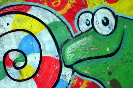 Street art. Abstract background image of a full completed graffiti painting with cartoon frog and lollipop.の写真素材