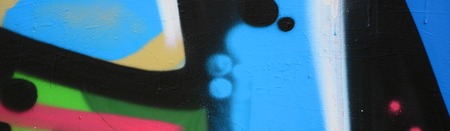 Street art. Abstract background image of a fragment of a colored graffiti painting in blue tones.の写真素材