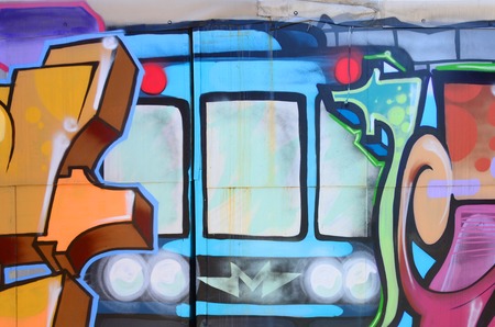 Street art. Abstract background image of a fragment of a colored graffiti painting in fashionable...