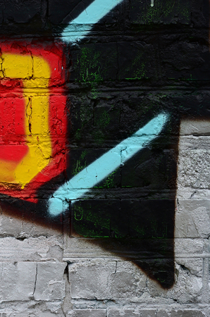 Street art. Abstract background image of a fragment of a colored graffiti painting in chrome and red tones.の写真素材