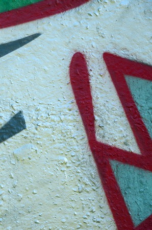 Street art. Abstract background image of a fragment of a colored graffiti painting in chrome and red tones.の写真素材