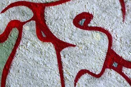 Street art. Abstract background image of a fragment of a colored graffiti painting in chrome and red tones.の写真素材