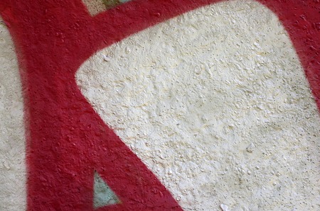 Street art. Abstract background image of a fragment of a colored graffiti painting in chrome and red tones.の写真素材