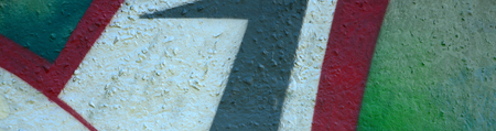 Street art. Abstract background image of a fragment of a colored graffiti painting in chrome and red...