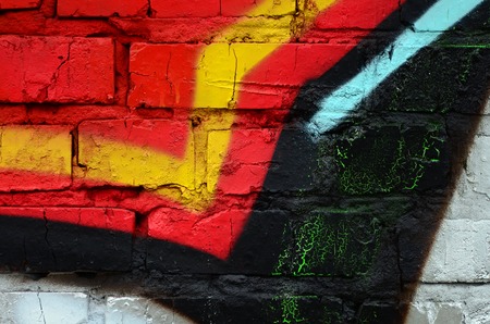 Street art. Abstract background image of a fragment of a colored graffiti painting in chrome and red tones.の写真素材