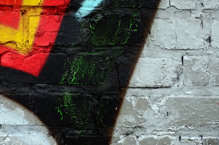 Street art. Abstract background image of a fragment of a colored graffiti painting in chrome and red tones.の写真素材