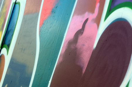 Street art. Abstract background image of a fragment of a colored graffiti painting in fashionable colors.の写真素材