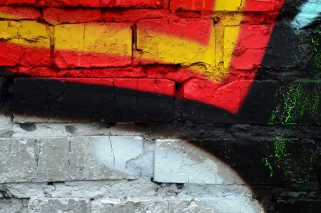 Street art. Abstract background image of a fragment of a colored graffiti painting in chrome and red tones.の写真素材