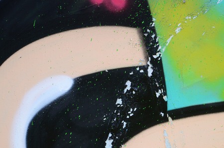 Street art. Abstract background image of a fragment of a colored graffiti painting in khaki green and orange tones.の写真素材