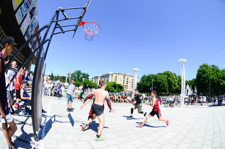 KHARKIV, UKRAINE - 27 MAY, 2018: Sports teams play streetball in the open air during the annual festival of street cultures.のeditorial素材