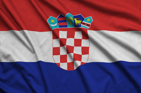 Croatia flag  is depicted on a sports cloth fabric with many folds. Sport team waving bannerの写真素材