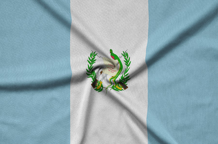 Guatemala flag  is depicted on a sports cloth fabric with many folds. Sport team waving bannerの写真素材
