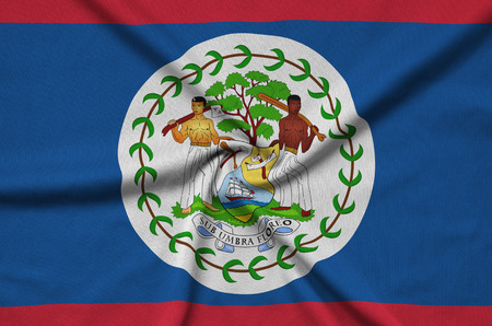 Belize flag  is depicted on a sports cloth fabric with many folds. Sport team waving bannerの写真素材