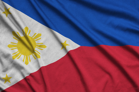 Philippines flag  is depicted on a sports cloth fabric with many folds. Sport team waving bannerの写真素材