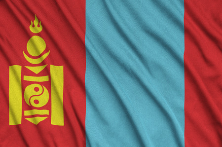Mongolia flag  is depicted on a sports cloth fabric with many folds. Sport team waving bannerの写真素材