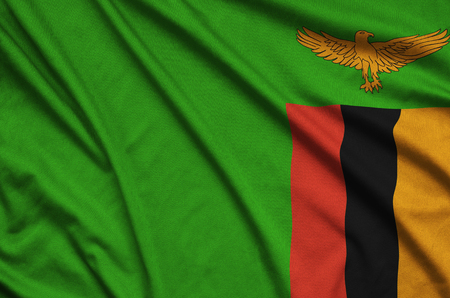 Zambia flag  is depicted on a sports cloth fabric with many folds. Sport team waving bannerの写真素材