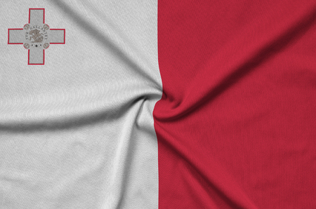 Malta flag  is depicted on a sports cloth fabric with many folds. Sport team waving bannerの写真素材