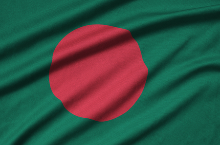 Bangladesh flag  is depicted on a sports cloth fabric with many folds. Sport team waving bannerの写真素材
