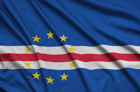Cabo verde flag  is depicted on a sports cloth fabric with many folds. Sport team waving bannerの写真素材
