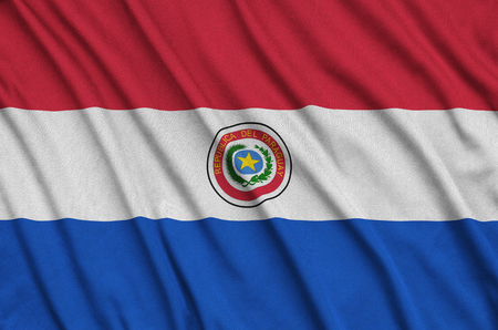 Paraguay flag  is depicted on a sports cloth fabric with many folds. Sport team waving bannerの写真素材
